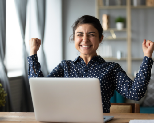 woman who's happy because she just landed a new job after networking successfully