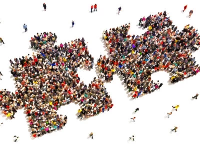 People putting the pieces together concept to show networking